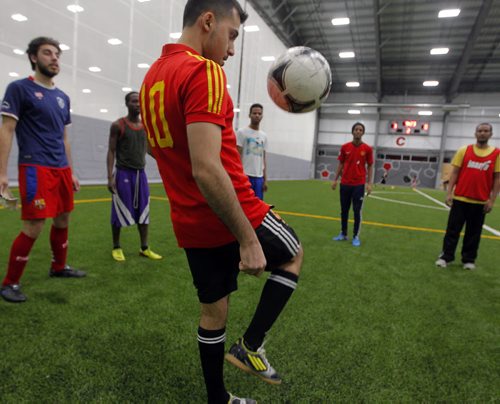 LOCAL - Newcomer men who meet every Friday night to play soccer and hang out with the guys so theyre not as isolated and stressed. Here is some of the men having some fun while they wait for their field time to happen(10pm). BORIS MINKEVICH / WINNIPEG FREE PRESS  JAN. 30, 2015