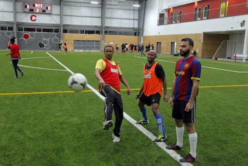 LOCAL - Newcomer men who meet every Friday night to play soccer and hang out with the guys so theyre not as isolated and stressed. Here is some of the men having some fun while they wait for their field time to happen(10pm). BORIS MINKEVICH / WINNIPEG FREE PRESS  JAN. 30, 2015