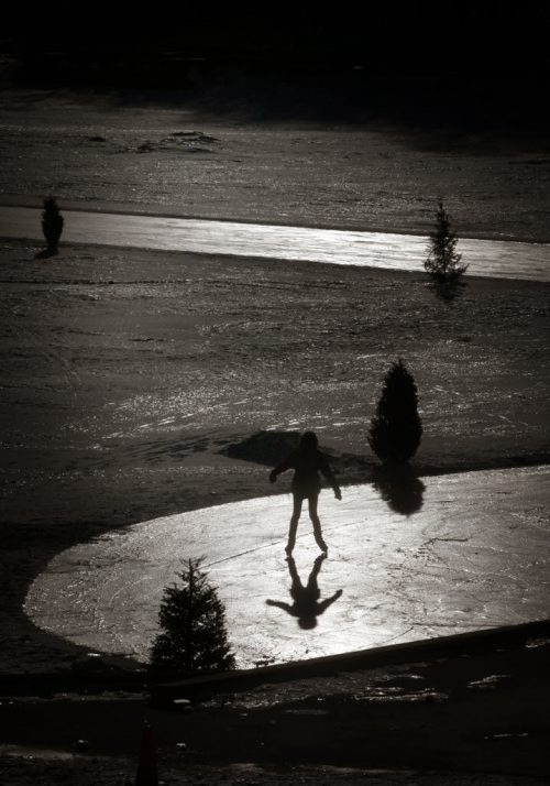 Sillouetted in the sun's icy glare, skaters make their way around the river trails on the Red River near Tache Monday afternoon......Weather Stand-Up..... February 2, 2015 - (Phil Hossack / Winnipeg Free Press).