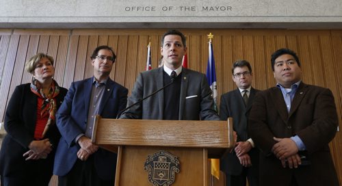 Winnipeg Mayor Brian Bowman,centre, and members of EPC speak to media at City Hall Tuesday.  Aldo Santin story. Wayne Glowacki/Winnipeg Free Press Feb.3 2015