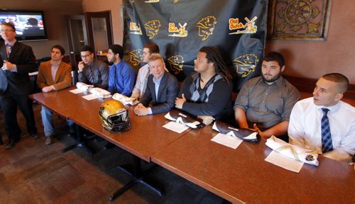 LOCAL - Bison football recruits. Team coach Brian Dobie announces to the media the new recruits from the team that sit with him. BORIS MINKEVICH / WINNIPEG FREE PRESS  FEB. 3, 2015