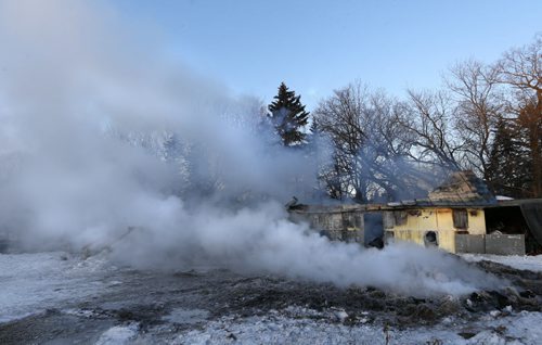 A smouldering horse barn by a home on Hillside Rd. near Deacon Rd. after an early morning fire killed several horses.  a web story  Wayne Glowacki/Winnipeg Free Press Feb.4  2015