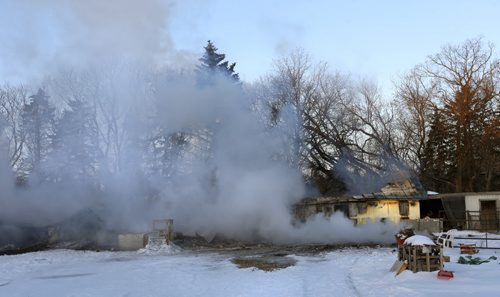 A smouldering horse barn by a home on Hillside Rd. near Deacon Rd. after an early morning fire killed several horses.  a web story  Wayne Glowacki/Winnipeg Free Press Feb.4  2015