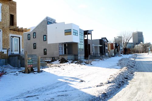 49.8 Feature: Housing market in Winnipeg Street view of new homes along Red River in St. Boniface with downtown Winnipeg in background.  Feb 04, 2015 Ruth Bonneville / Winnipeg Free Press