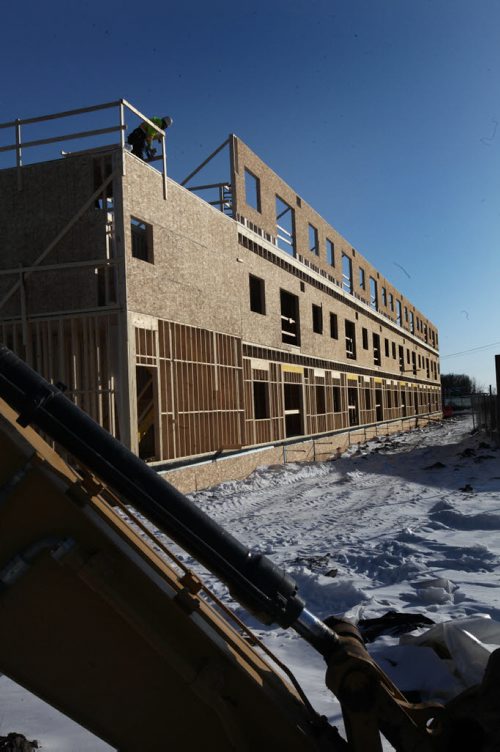 49.8 Feature: Housing market in Winnipeg Construction workers work on a condo development on St. Annes Rd. near the Perimeter Hwy. called "The Woods at Creek Bend" Wednesday afternoon.  Feb 04, 2015 Ruth Bonneville / Winnipeg Free Press