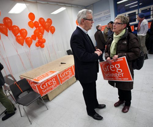 Premier Greg Selinger speaks with a supporter at a leadership rally held in the Riverview Community Centre Wednesday evening. See story. February 4, 2015 - (Phil Hossack / Winnipeg Free Press)