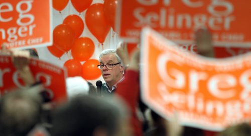 Premier Greg Selinger speaks to a friendly crowd at a leadership rally held in a small but packed room at the Riverview Community Centre Wednesday evening. See story. February 4, 2015 - (Phil Hossack / Winnipeg Free Press)