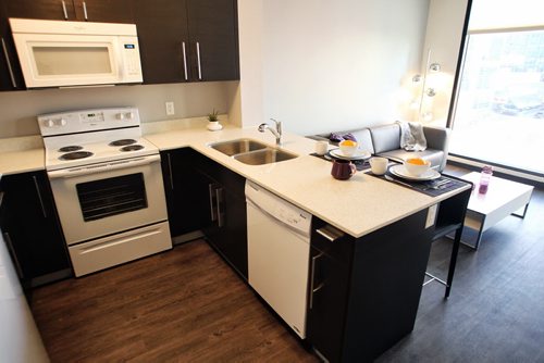 The kitchen of one of the apartments at Marie Rose Place 207 Edmonton St a new six-storey building thatÄôs now open and provides supportive housing for immigrant and refugee women. 150205 February 05, 2015 Mike Deal / Winnipeg Free Press