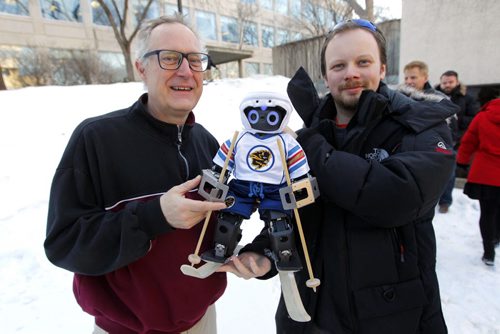 LOCAL - Jennifer, the first hockey-playing robot, was built at the University of Manitoba and featured on science TV shows. Now, shes taken to the slopes, although shes not ready for the black diamond runs. But maybe the bunny hill. Photo taken in behind the U of M Engineering faculty. Besides the robot, Computer Science prof. Jacky Baltes, who co-directs the autonomous agents lab, and computer science graduate student Chris Iverach-Brereton. BORIS MINKEVICH / WINNIPEG FREE PRESS  FEB. 5, 2015