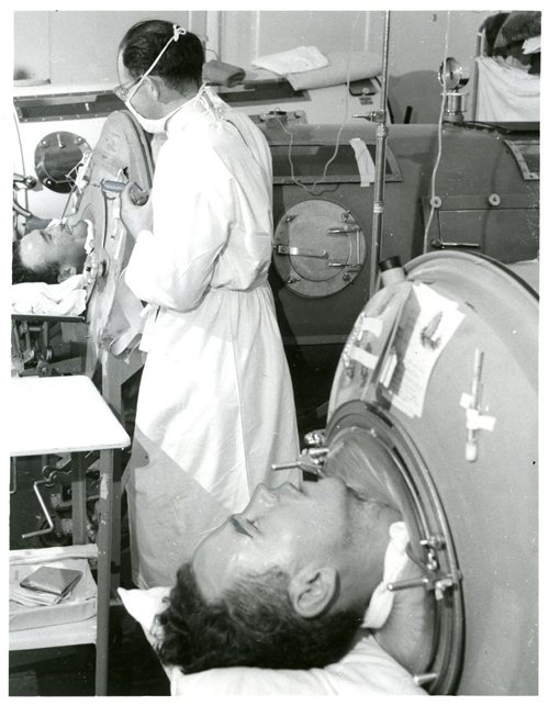 Arthur O. McConkey, a polio victim, lies in an iron lung in King George hospital. Winnipeg Free Press 1952