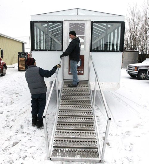 LOCAL -  NATURAL HABITAT'S AURORA POD -New portable northern lights viewing station, custom made for tourism in Churchill, built by Anything Custom on Waverley. General manager Sheldon Walkoski, on the steps right, talks to an unnamed empolyee. BORIS MINKEVICH / WINNIPEG FREE PRESS  FEB. 6, 2015