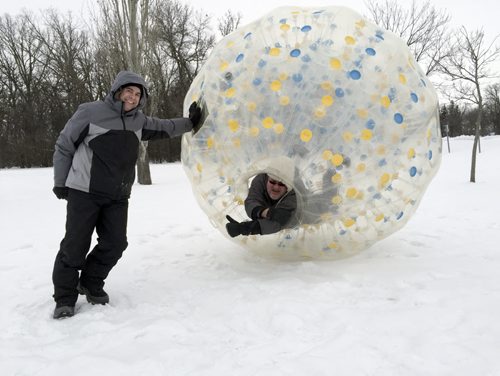 Rich Hince, owner of Games2U Winnipeg, poses with Free Press columnist Doug Speirs, in a life-sized clear plastic Hamster Ball, at Assiniboine Park. February 6, 2015 Tyler Walsh / Winnipeg Free Press