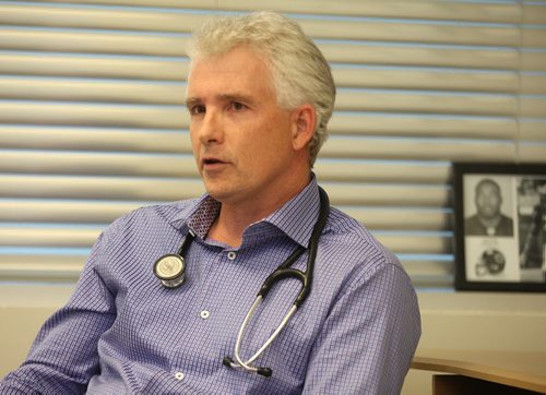 Disgruntled doctors, Dr. Brent Young talks with Larry Kusch Friday afternoon at his clinic. He's angry with the College of Physicians new on-call policy. See story. February 6, 2015 - (Phil Hossack / Winnipeg Free Press)