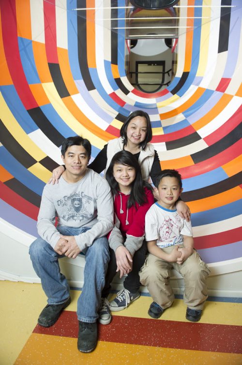 150206 Winnipeg - DAVID LIPNOWSKI / WINNIPEG FREE PRESS (February 06, 2015)  Mom, Mila Dacwag with husband Romil, daughter Shennin (13) and son Charles (8)  following a session with newcomer moms that are participating in a community development program run by the Aurora Family Therapy Centre at the ChildrenÄôs Museum at The Forks Friday February 6, 2015. The program is in place to help prevent moms from being isolated and help them in their settlement in Winnipeg.  Carol Sanders 49.8 feature about newcomers dealing with mental health issues and physical disabilities