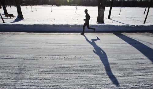An early morning jogger makes their way through Kildonan Park Sunday.  150208 February 08, 2015 Mike Deal / Winnipeg Free Press