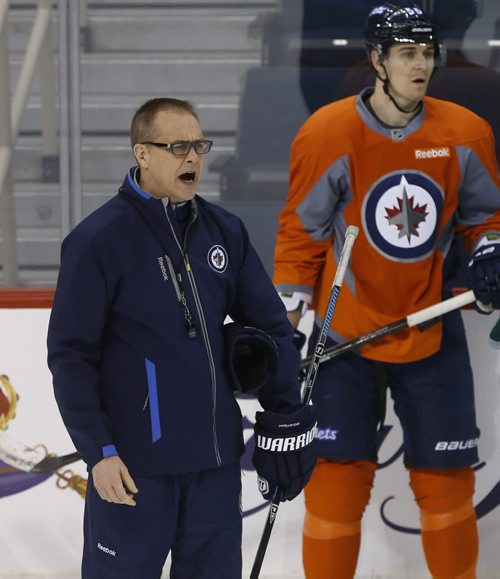 Winnipeg Jets Head Coach Paul Maurice raises the volume during a drill at the team's  practice in the MTS Centre Monday in preparation for Tuesday night's game against the Minnesota Wild. Ed Tait/Time Campbell stories Wayne Glowacki/Winnipeg Free Press Feb.9  2015