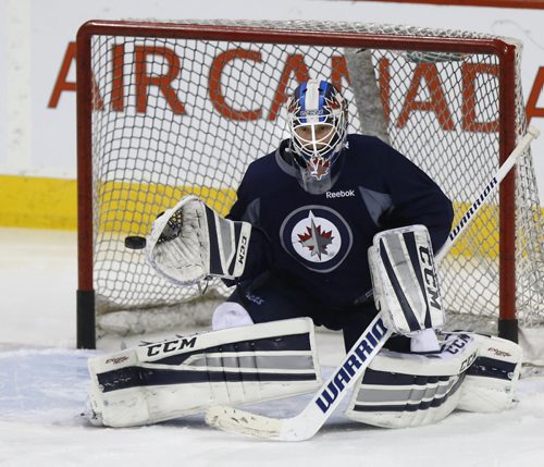 Winnipeg Jets goaltender  Michael Hutchinson at the team's  practice in the MTS Centre Monday in preparation for Tuesday night's game against the Minnesota Wild. Ed Tait/Time Campbell stories Wayne Glowacki/Winnipeg Free Press Feb.9  2015