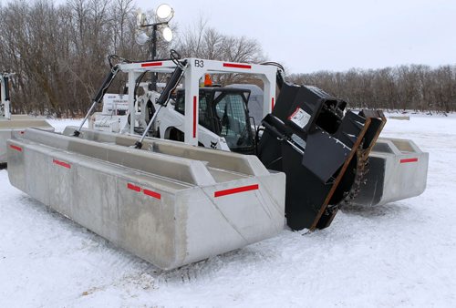 STANDUP - Ice cutting machines are marshalling at the End of Main at Netley Creek, north of Selkirk, Manitoba. North Red Waterways Maintenance Corp. runs the operation. The units are all unmanned remote controlled. When they cut the operator will be in an amphibious Argo a safe distance away from the actual cutting. The crew will cut for 4-6 weeks and then the Amphibex ice breakers will move in to open up the waterway. BORIS MINKEVICH / WINNIPEG FREE PRESS  FEB. 9, 2015