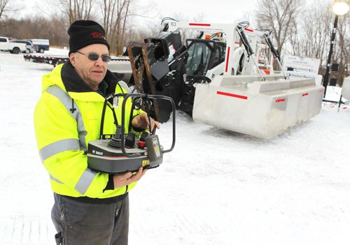 STANDUP - Ice cutting machines are marshalling at the End of Main at Netley Creek, north of Selkirk, Manitoba. In photo Ray Cobert of North Red Waterways Maintenance Corp. holds a remote control for the cutting unit. When they cut the operator will be in an amphibious Argo a safe distance away from the actual cutting. The crew will cut for 4-6 weeks and then the Amphibex ice breakers will move in to open up the waterway. BORIS MINKEVICH / WINNIPEG FREE PRESS  FEB. 9, 2015
