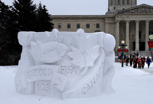 Premier Greg Selinger leads a group representing the Winnipeg Blue Bombers and 103rd Grey Cup Festival, Festival du Voyageur and 2015 FIFA Women's World Cup all captured in a snow sculpture in front of the Manitoba Legislative Bld. These are some of the major events taking place this year. Wayne Glowacki/Winnipeg Free Press Feb.10   2015