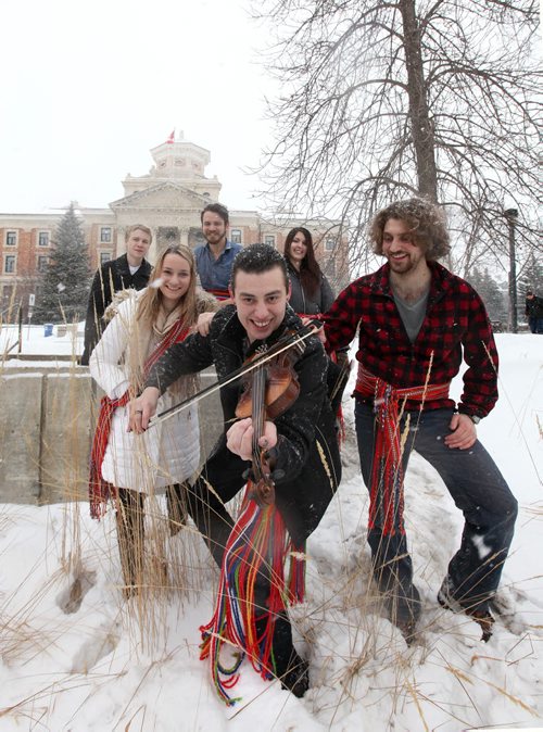 49.8 feature on What / Who is Metis?  Metis University Students' Association President: Brad Boudreau  (fiddle) along with student members of the associations are proud of their Metis roots as they wear their  sashes for a photo at the U of M. Names: Alana Robert (left, blond), Chris Allard (left rear), Erik Klassen (rear centre,wt blue shirt), Chalena McKay (long black hair), Jamal Abas (right, curly hair) and Metis University Students' Association President: Brad Boudreau (front wt fiddle).  Feb 10, 2015 Ruth Bonneville / Winnipeg Free Press