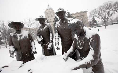 Left to right, Emily Murphy, Irene Parlby, Louise McKinney, and Nellie McClung in a legislative ground statue. See Jenn Zoratti's story.  February 10, 2015 - (Phil Hossack / Winnipeg Free Press)
