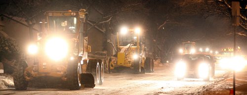 City snow clearing operations began in earnest Tuesday evening. Graders and plows move along Leila ave near Salter about 730pm. See story. February 10, 2015 - (Phil Hossack / Winnipeg Free Press)