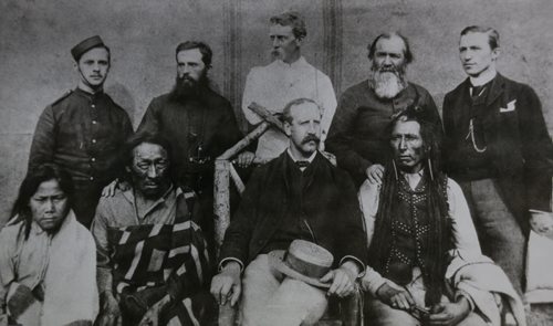 Group photo in Regina 1885. Front row (left to right) Horse Child, youngest of Big Bear's sons, Big Bear, A.D. Stewart, Poundmaker Rear: Constable Black, NW Mounted Police, Rev. Louis Cochin, Captain Dean,  NW Mounted Police, Rev. Alexis Andre, Berveley Robertson. Archives of Manitoba,