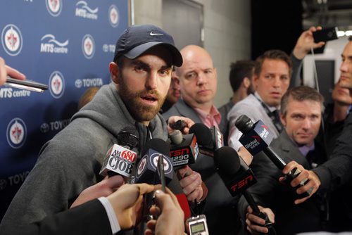 SPORTS - Winnipeg Jets Andrew Ladd talks to the media after the trade announcement by general manager Kevin Cheveldayoff at the MTS Centre. BORIS MINKEVICH / WINNIPEG FREE PRESS  FEB. 11, 2015