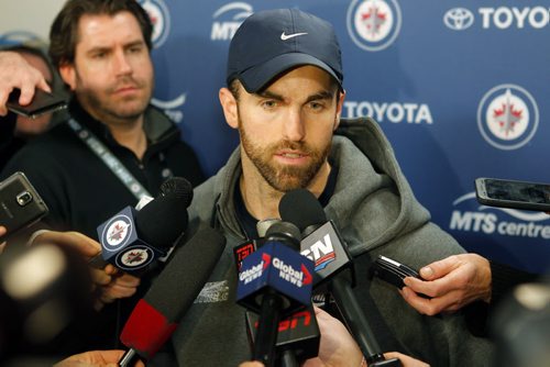 SPORTS - Winnipeg Jets Andrew Ladd talks to the media after the trade announcement by general manager Kevin Cheveldayoff at the MTS Centre. BORIS MINKEVICH / WINNIPEG FREE PRESS  FEB. 11, 2015
