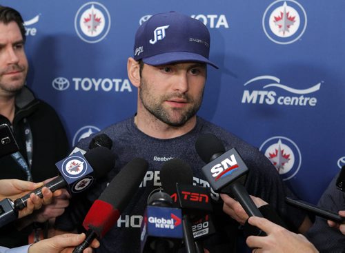 SPORTS - Winnipeg Jets player Mark Stuart talks to the media after the teams trade announcement at the MTS Centre. BORIS MINKEVICH / WINNIPEG FREE PRESS  FEB. 11, 2015