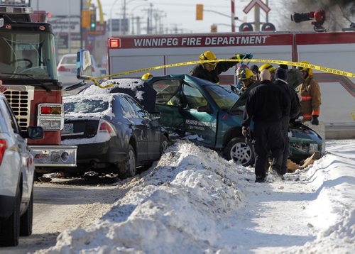 NEWS - STANDUP - MVC on Ellice Ave. between Strathcona Street and Empress Street. Extrication on a person was being done. BORIS MINKEVICH / WINNIPEG FREE PRESS  FEB. 11, 2015