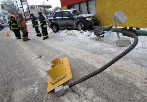 Fireman on scene to a three car mva this morning at Talbot and Watt Ave in front of Sparkus construction - Winnipeg Police cadets are on scene directing traffic as they wait for signals to repair a knocked over traffic light  Breaking News- Feb 12, 2015   (JOE BRYKSA / WINNIPEG FREE PRESS