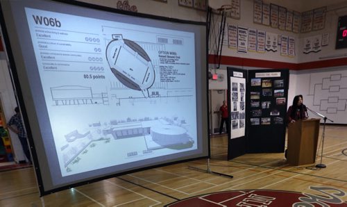 Joyce Wong, vice principal of Kelvin High School shows one of the proposed designs for the Active Living Centre. The $1 million fundraising campaign  was launched at Kelvin Thursday. Nick Martin story. Wayne Glowacki/Winnipeg Free Press Feb.12   2015