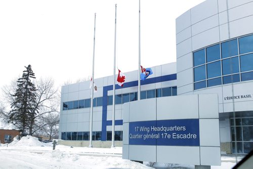 NEWS - Flags fly at half mast at 17 Wing in Winnipeg. SAR Tech Sergeant Mark Salesse died during training in Alberta. BORIS MINKEVICH / WINNIPEG FREE PRESS  FEB. 12, 2015