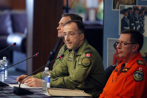 NEWS - back to front- Commanding Officer  (CO) Lieutenant- Colonel Brent Andrews 435 Transport and Rescue Squadron, (middle) 17 Wing Commander, Colonel Joël Roy, and Chief Warrant Officer (CWO) André  Daigle - Search and Rescue Technician Senior Occupation Advisor during the press conference at 17 Wing. Topic: SAR Tech Sergeant Mark Salesse died during training in Alberta. BORIS MINKEVICH / WINNIPEG FREE PRESS  FEB. 12, 2015