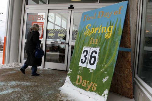 STANDUP WEATHER - A bundled up Home Depot shopper dashes past a sign reminding us of how many days until spring. The Bishop Grandon location puts a little hope into it's shoppers stride. BORIS MINKEVICH / WINNIPEG FREE PRESS  FEB. 12, 2015