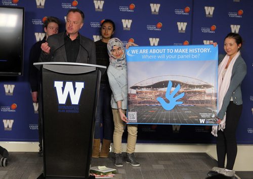 LOCAL - The Winnipeg Blue Bomber and Investors Group Field officially launch the Pembina Trails Human Rights Project. In May, our entire school division will converge on Investors Group Field and transform the turf into a massive mosaic highlighting human rights of children. Cameron Cross, Visual Arts Consultant, Pembina Trails School Division talks to the media as kids from the school division that are creating art stand behind him on stage. BORIS MINKEVICH / WINNIPEG FREE PRESS  FEB. 12, 2015
