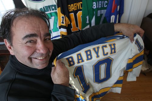 Wayne Babych a former NHL hockey player comments on how big trades effect teams- He holds one of his St Louis Blues Jerseys-See Geoff Kirybson story  - Feb 13, 2015   (JOE BRYKSA / WINNIPEG FREE PRESS)