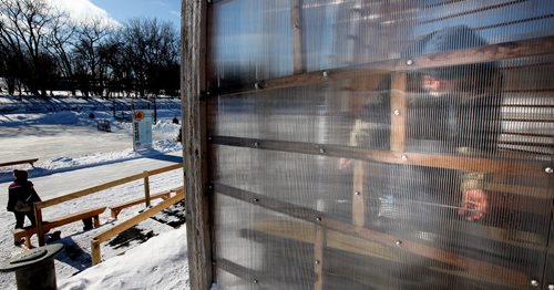A little Sun goes a long way, taking advantage of the solar gain in an Assinaboine River warming hut, Werner Wolke laces his skates before heading out on the Fork's skating trails Friday afternoon. STAND-UP. February 13, 2015 - (Phil Hossack / Winnipeg Free Press)