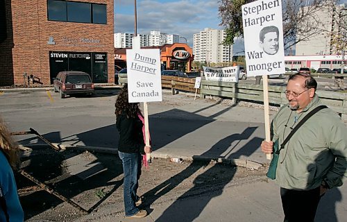 BORIS MINKEVICH / WINNIPEG FREE PRESS  070925 The Communist Party of Canada protests in front of Steven Fletcher's office on Portage Ave.