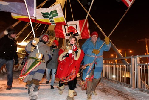 The Festival du Voyageur kicked off its annual event with a torch light walk that started at the CMHR, headed over the Provencher bridge and went through the St. Boniface Cathedral ruins before heading to Fort Gibraltor Friday night.  Minister Shelly Glover was one of the flag bearers.   Feb 13, 2015 Ruth Bonneville / Winnipeg Free Press
