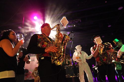 The JC Dixie Drives band play southern swing as they make their way around the crowd at the 10th annual Mardi Gras Friday night at the RBC Convention Centre.  Feb 13, 2015 Ruth Bonneville / Winnipeg Free Press