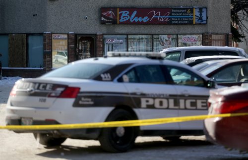 Police at the scene of a stabbing on Sargent Avenue at Young Street, Saturday, February 14, 2015. (TREVOR HAGAN/WINNIPEG FREE PRESS)