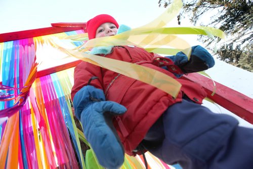 Two-year-old Eric White loves passing through layers of multi-coloured, fun, strips of plastic while making his way into the children's play area at The Festival du Voyageur  Saturday.  Feb 14, 2015 Ruth Bonneville / Winnipeg Free Press