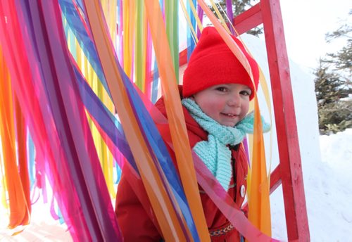 Two-year-old Eric White loves passing through layers of multi-coloured, fun, strips of plastic while making his way into the children's play area at The Festival du Voyageur  Saturday.  Feb 14, 2015 Ruth Bonneville / Winnipeg Free Press