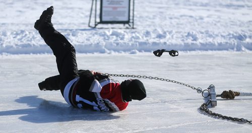 Escape artist, Dean Gunnarson is dragged a short distance during an escape between two zamboni's on the Red River near The Forks, Saturday, February 14, 2015. (TREVOR HAGAN/WINNIPEG FREE PRESS)