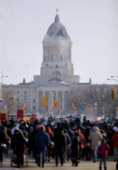 The Women's Memorial March of Manitoba departs from the University of Winnipeg and heads up Memorial Boulevard, raising awareness for missing and murdered Indigenous women across the country, Saturday, February 14, 2015. (TREVOR HAGAN/WINNIPEG FREE PRESS)