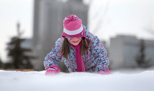 Eight-year-old Cherine Nichols climbs up a maze in the  children's play area at The Festival du Voyageur  Saturday.  Feb 14, 2015 Ruth Bonneville / Winnipeg Free Press