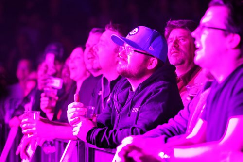 Front row fans of the Tragically Hip watch the band perform on stage at  MTS Centre Saturday night.   Feb 14, 2015 Ruth Bonneville / Winnipeg Free Press